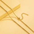 Gold chain on a yellow background