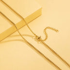 Gold chain on a yellow background