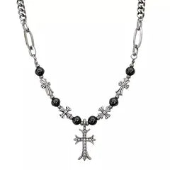Necklace with black beads and silver cross pendant on a white background