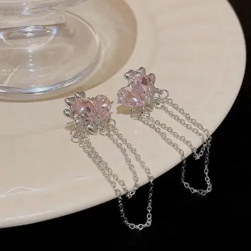 Pink Ballroom Earrings - These Exquisite Statement Hoops featuring delicate pink heart-shaped stones with silver chains hanging elegantly, perfect for stylish statement jewelry looks.