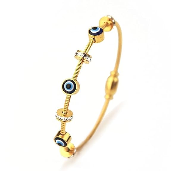Gold bracelet with blue evil eye beads on a white background