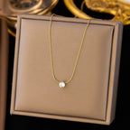 Old-Tone Solitaire Pendant Necklace featuring a delicate gold-plated chain with a single sparkling solitaire stone, an elegant and minimalist fashion jewelry piece.