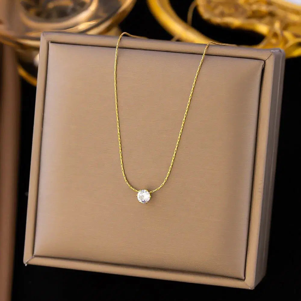 Old-Tone Solitaire Pendant Necklace featuring a delicate gold-plated chain with a single sparkling solitaire stone, an elegant and minimalist fashion jewelry piece.