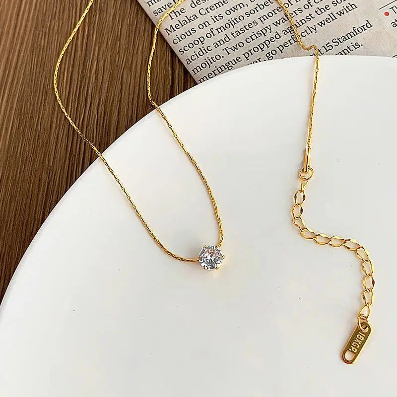 Old-Tone Solitaire Pendant Necklace featuring a delicate gold chain with a single sparkling solitaire gemstone, ideal for elegant daily wear and minimalist fashion jewelry.
