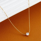Delicate gold chain featuring the Old-Tone Solitaire Pendant Necklace with a single sparkling clear stone, perfect for elegant daily wear and minimalist fashion jewelry looks.
