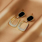 Black Geometric Square Statement Elegant Drop Earrings featuring black geometric squares with gold-tone open square drops adorned with small crystals, elegant fashion jewelry for women.