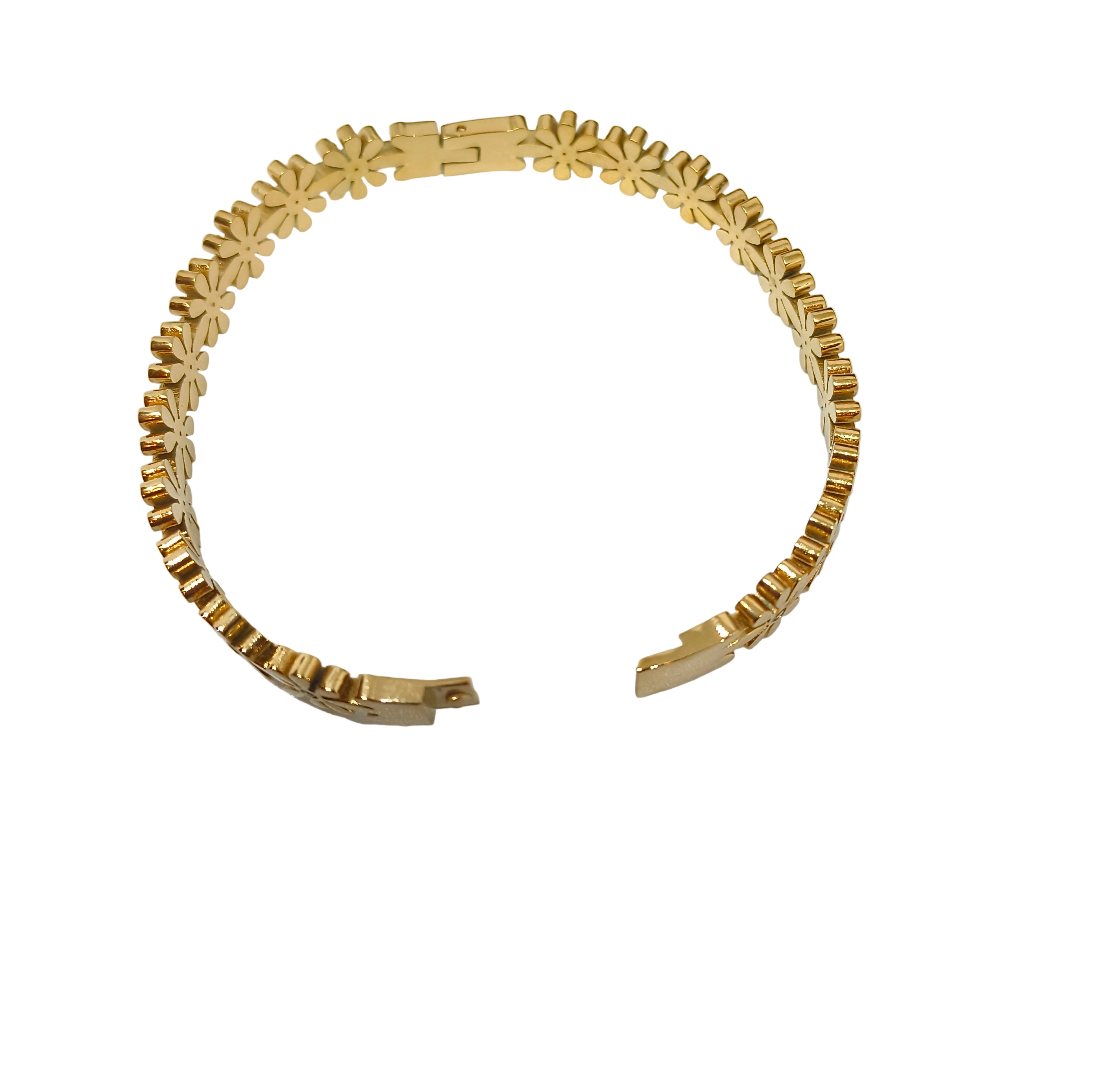 A gold-toned open cuff bracelet with a repeating flower or starburst link pattern, photographed on a white surface.