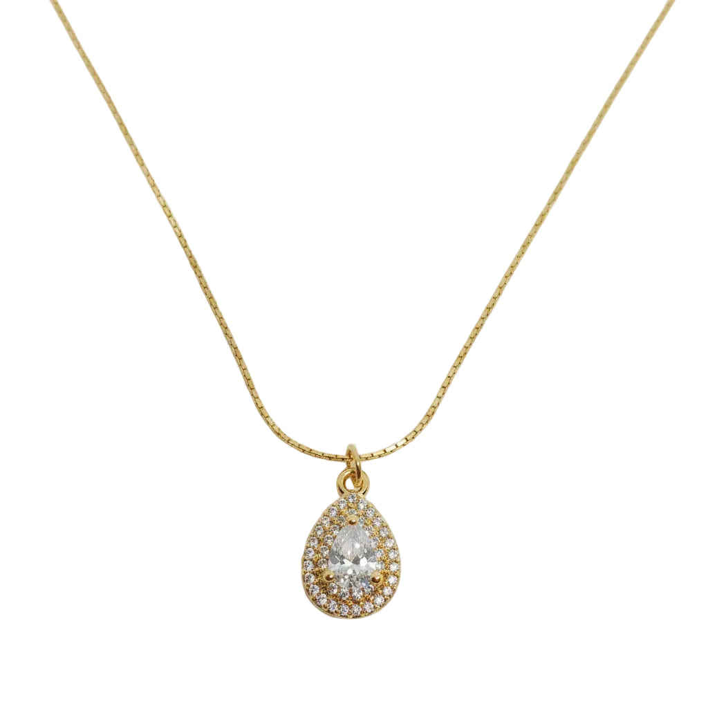 A gold chain necklace with a teardrop-shaped pendant featuring a clear central gemstone surrounded by a halo of small clear stones, displayed on a clean white background.