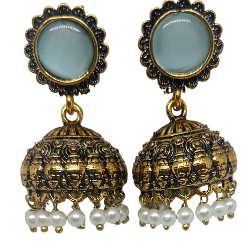 A pair of traditional Indian jhumka earrings with round light blue stone studs, gold-plated filigree bells, and dangling white faux pearls, shown on a plain white background.