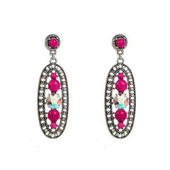 Pair of earrings with pink gemstones on a white background