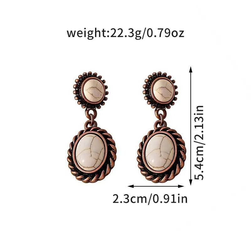Pair of earrings with measurements and weight displayed on a white background