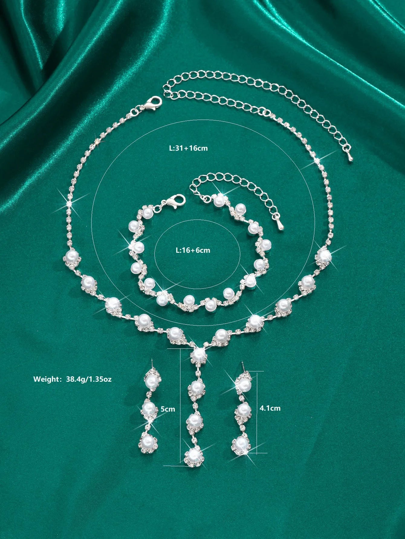 Pearl jewelry set with necklace, bracelet, and earrings on a green satin background with measurements.
