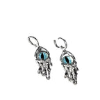 Pair of silver earrings with blue gemstones on a gray background, showing measurements and weight.