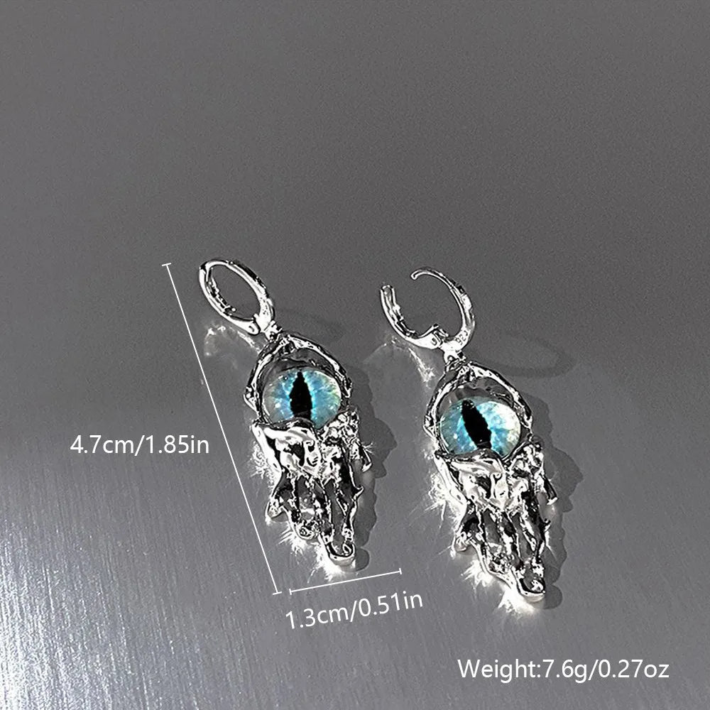 Pair of silver earrings with blue gemstones on a gray background, showing measurements and weight.