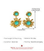 Gold earrings with turquoise stones and measurement details on a white background