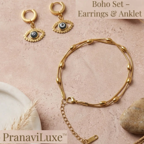 Gold-tone jewelry set including a beaded chain necklace and matching hoop earrings with evil eye charms