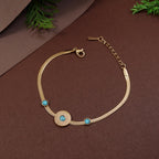 Gold bracelet with turquoise stones on a brown background