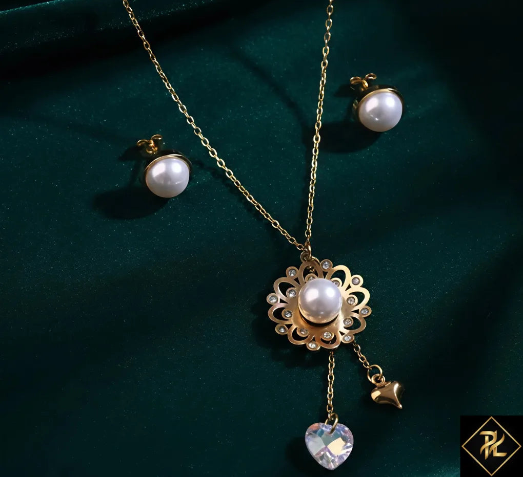 Pearl necklace and earrings set on a dark green background