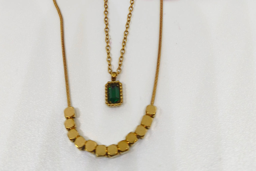 Green Stone Layered Necklace featuring a gold-toned design with a rectangular green stone pendant and a beaded chain, ideal for elegant fashion jewelry looks.