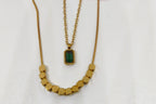 Green Stone Layered Necklace featuring a gold-toned design with a rectangular green stone pendant and a beaded chain, ideal for elegant fashion jewelry looks.