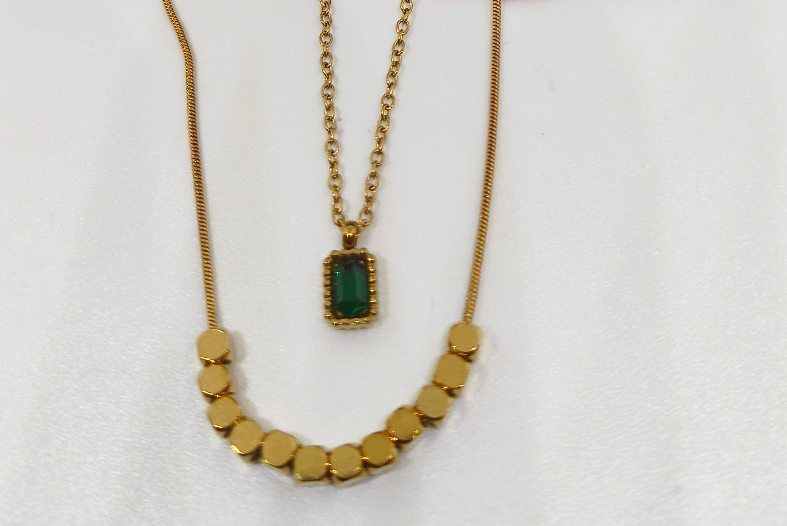 Green Stone Layered Necklace featuring a gold-toned design with a rectangular green stone pendant and a beaded chain, ideal for elegant fashion jewelry looks.