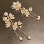 Delicate Long Flower Tassel Jewelry Earring featuring translucent white floral motifs with pearl accents and fine gold-toned chains, perfect for elegant and stylish occasions.