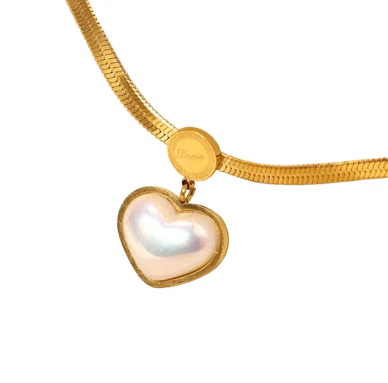 Love Heart Shaped Pearl Pendant Necklace with a gold plated chain and a heart-shaped pearl pendant framed in gold, featuring a delicate "Love" engraving on the clasp.