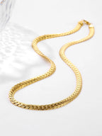 Gold chain necklace on a white background