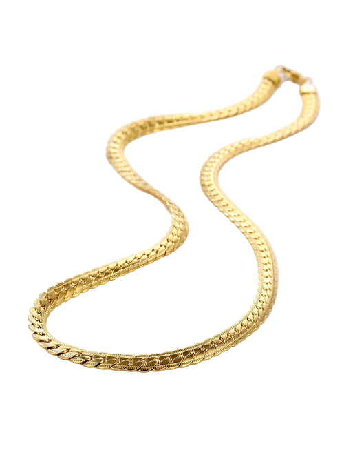 Gold chain necklace on a white background