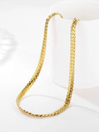 Gold chain necklace on a white background