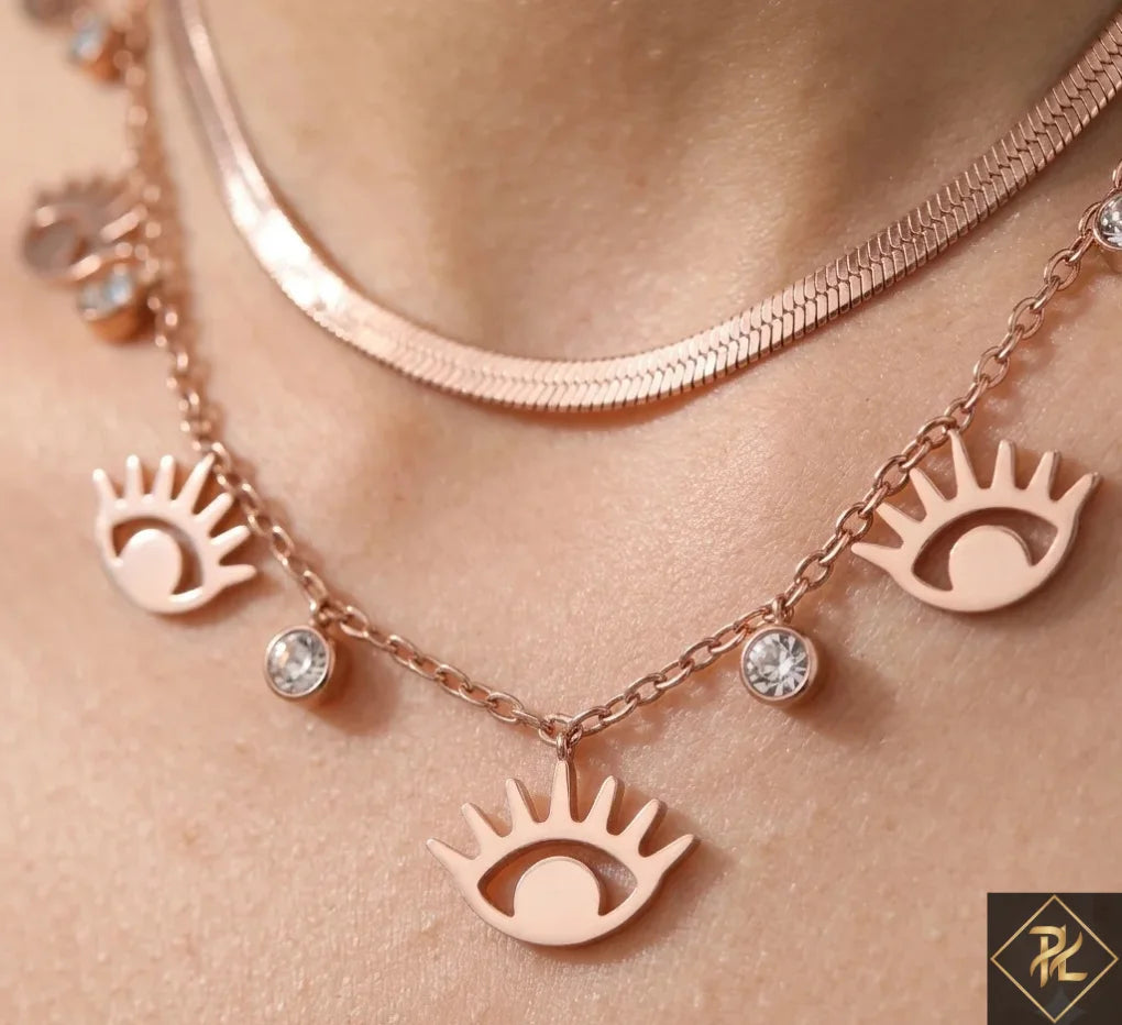 Necklace with eye-shaped pendants on a person's neck