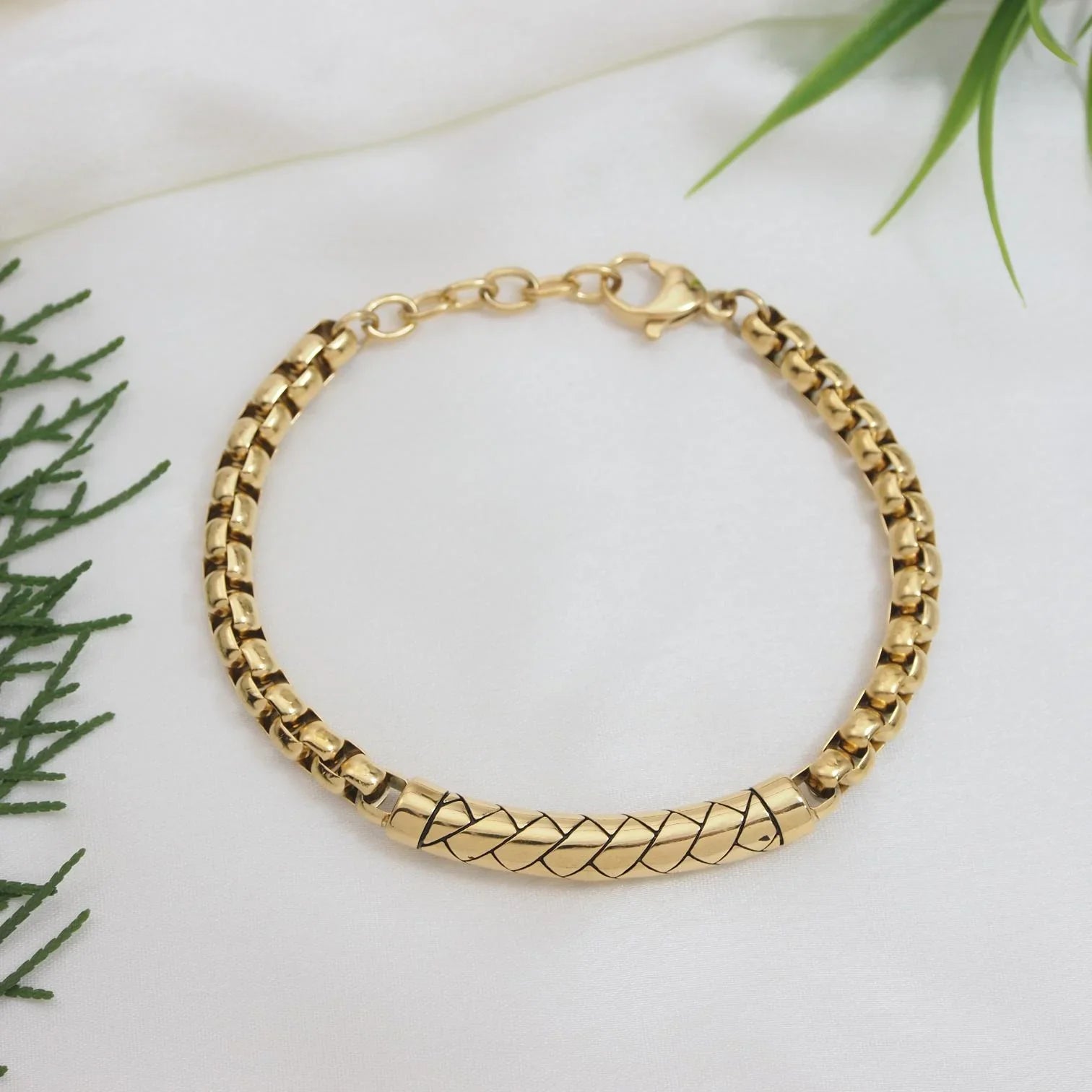 Men's Stainless Steel Bracelet Gold Chain - PranaviLuxe featuring a polished gold-tone link design with a textured central tube detail, reflecting luxury fashion jewelry style.