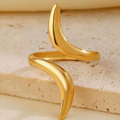 Serpentine Line Ripple Ring featuring a sleek, curved design in polished gold tone, perfect for adding a modern and elegant touch to your fashion jewelry collection.