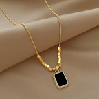 Square Beads Black Pendant Chain Necklace featuring gold square beads with a black rectangular pendant surrounded by a delicate gold frame, elegant fashion jewelry for women.