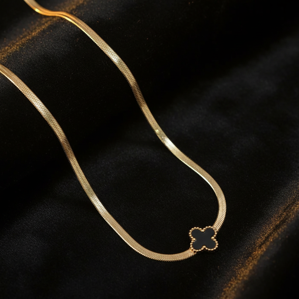 Black Clover Snake Chain Necklace on Dark Velvet