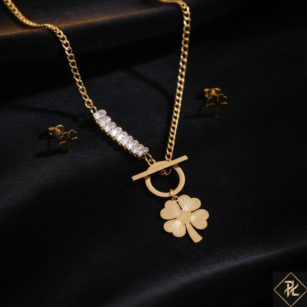 Gold Clover Necklace Set on Dark Velvet