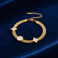 Gold Mesh Bracelet with White Floral Charms on Dark Velvet