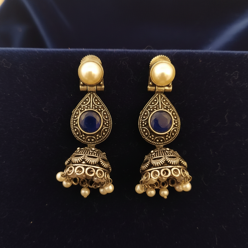 Oxidized Silver Blue Stone Jhumka Earrings on Dark Velvet