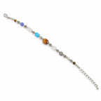 A silver chain bracelet with a series of colorful beads, including a large round brown tiger's eye bead, a light blue cube bead, a medium blue bead, a white oval bead, a gray round bead, and small metallic silver beads, displayed on a clean white background.