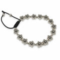 A silver-toned beaded bracelet featuring a series of small flower-shaped beads connected by small round beads, with a black adjustable cord closure on a white background.