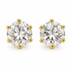 A pair of round-cut diamond stud earrings in a six-prong yellow gold setting, shown on a clean white background.