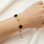 LOVE" Engraved Black Onyx & CZ Bezel Station Love Bracelet